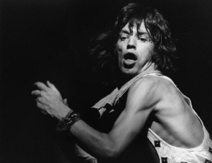 Mick Jagger on stage and youthful. 
